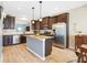 Kitchen featuring granite countertops, stainless appliances, dark cabinetry, and an island at 5034 Little Harbor Way, Acworth, GA 30101