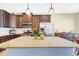 Kitchen with granite counters, stainless appliances, dark cabinets and breakfast area at 5034 Little Harbor Way, Acworth, GA 30101
