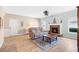 Bright living room featuring a decorative fireplace, hardwood floors, and comfortable seating at 5034 Little Harbor Way, Acworth, GA 30101