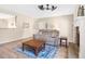 Comfortable living room with wood floors, a fireplace, and ample seating at 5034 Little Harbor Way, Acworth, GA 30101