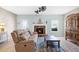 Inviting living room with a stone fireplace at 5034 Little Harbor Way, Acworth, GA 30101