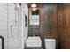 Bathroom features a walk-in shower and dark wood accent wall with mounted sink at 1433 Carroll Drive Nw, Unit #3, Atlanta, GA 30318