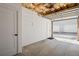 Empty two car garage with unfinished ceiling and multiple garage doors outside at 1433 Carroll Drive Nw, Unit #3, Atlanta, GA 30318