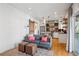 Open-concept living area flowing into a modern kitchen with hardwood floors and natural light at 1433 Carroll Drive Nw, Unit #3, Atlanta, GA 30318