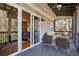 Relaxing screened porch with comfortable seating and a view of the outdoors at 1433 Carroll Drive Nw, Unit #3, Atlanta, GA 30318
