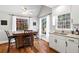 Charming eat-in kitchen area with bright windows, granite countertops, and breakfast bar seating at 6009 Wyndham Woods Dr, Powder Springs, GA 30127