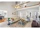 Bright living room with high ceilings, a cream sofa, and beautiful hardwood floors at 6009 Wyndham Woods Dr, Powder Springs, GA 30127