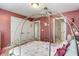 Charming pink bedroom featuring a unique carriage bed frame and two closets at 5136 Heron Bay Blvd, Locust Grove, GA 30248