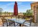 Outdoor deck area perfect for entertaining with table, chairs and an umbrella at 5136 Heron Bay Blvd, Locust Grove, GA 30248