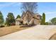 Lovely home with lush lawn, wide driveway and mature trees in a desirable neighborhood at 5136 Heron Bay Blvd, Locust Grove, GA 30248
