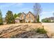 Beautifully landscaped lawn leads to a lovely brick home with an inviting entrance at 5136 Heron Bay Blvd, Locust Grove, GA 30248