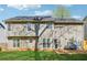 View of backyard with grass and patio at 880 Hillary Ln, Lawrenceville, GA 30043