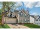 Exterior view of the home with a well-manicured lawn, charming shutters, attached garage and driveway at 880 Hillary Ln, Lawrenceville, GA 30043