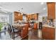 Bright kitchen with an island and bar seating, stainless steel appliances, wood cabinets, and hardwood floors at 880 Hillary Ln, Lawrenceville, GA 30043