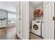 Laundry room with washer and dryer and shelving at 880 Hillary Ln, Lawrenceville, GA 30043