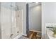 Newly renovated walk-in shower with glass doors, tiled walls, and modern fixtures at 880 Hillary Ln, Lawrenceville, GA 30043