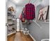 Walk-in closet with closet system, shelving, and ample storage space for clothes and accessories at 880 Hillary Ln, Lawrenceville, GA 30043