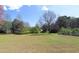 Expansive backyard offering lots of space and mature trees for outdoor activities and relaxation at 895 Burton Ridge Dr, Loganville, GA 30052