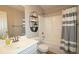 Bathroom featuring a shower and tub combination, a white sink vanity, and neutral paint at 895 Burton Ridge Dr, Loganville, GA 30052