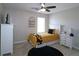Bedroom with light-colored walls, a twin bed with sunflower bedding, and an accent rug at 895 Burton Ridge Dr, Loganville, GA 30052