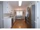 Bright kitchen with stainless steel appliances and adjacent dining area at 895 Burton Ridge Dr, Loganville, GA 30052