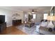 Inviting living room with hardwood floors, a large sofa, and stylish decor, providing a comfortable setting at 895 Burton Ridge Dr, Loganville, GA 30052