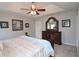 Comfortable main bedroom featuring trey ceiling, fan, and ample natural light at 895 Burton Ridge Dr, Loganville, GA 30052
