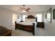 Spacious main bedroom with trey ceiling, ceiling fan and windows at 895 Burton Ridge Dr, Loganville, GA 30052