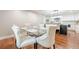 Open-concept dining area with elegant seating and modern finishes, seamlessly connecting to the kitchen space at 4446 Huntington Cir, Atlanta, GA 30338
