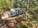 Aerial view of a lovely home, featuring an attached garage and lush landscaping at 4446 Huntington Cir, Atlanta, GA 30338