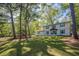 Well-maintained two-story home with a sprawling front lawn and a picturesque setting at 4446 Huntington Cir, Atlanta, GA 30338