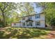 Charming two-story home with a welcoming entrance and well-maintained landscaping at 4446 Huntington Cir, Atlanta, GA 30338