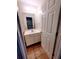 Cozy bathroom featuring a single sink vanity, neutral walls, and tile flooring at 523 Lantern Wood Dr, Scottdale, GA 30079