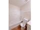 Bathroom with white fixtures including a toilet and bathtub and a separate shower at 523 Lantern Wood Dr, Scottdale, GA 30079