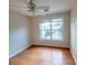 Bedroom featuring hardwood floors, a ceiling fan, and a window with blinds at 523 Lantern Wood Dr, Scottdale, GA 30079