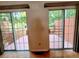 Indoor view of the wooden deck, visible through glass sliding doors at 523 Lantern Wood Dr, Scottdale, GA 30079