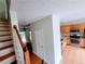 Open kitchen area with stainless steel appliances and wooden cabinets and an island sink at 523 Lantern Wood Dr, Scottdale, GA 30079