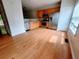 Open kitchen features stainless appliances, wooden cabinets and hardwood flooring at 523 Lantern Wood Dr, Scottdale, GA 30079