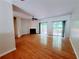 Spacious living area features hardwood floors, a fireplace, and sliding doors to a private backyard deck at 523 Lantern Wood Dr, Scottdale, GA 30079