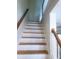 White and wooden staircase leading to the second floor at 523 Lantern Wood Dr, Scottdale, GA 30079