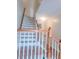 Elegant staircase with white risers and wooden handrail, enhancing the home's interior appeal at 523 Lantern Wood Dr, Scottdale, GA 30079