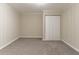 This bedroom has neutral walls, carpet, closet and trim, providing a blank canvas for any decor at 2062 Whites Mill Rd, Decatur, GA 30032