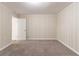 Bedroom is carpeted, with neutral painted walls, trim, has a window and access to a hallway at 2062 Whites Mill Rd, Decatur, GA 30032