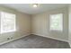 The bedroom features neutral walls, carpet and two large windows providing natural light at 2062 Whites Mill Rd, Decatur, GA 30032