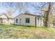 Cozy home with white siding, black trim, and small yard at 2062 Whites Mill Rd, Decatur, GA 30032