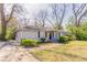 A cozy one story home with manicured front bushes and a side driveway at 2062 Whites Mill Rd, Decatur, GA 30032