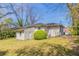 Exterior of a home with a large backyard and mature trees at 2062 Whites Mill Rd, Decatur, GA 30032
