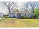 Charming single-story home featuring a well-maintained lawn and mature trees at 2062 Whites Mill Rd, Decatur, GA 30032
