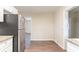 Bright kitchen with stainless steel fridge and granite counters at 2062 Whites Mill Rd, Decatur, GA 30032