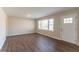 A well-lit living room with hardwood floors and a view of the front yard at 2062 Whites Mill Rd, Decatur, GA 30032